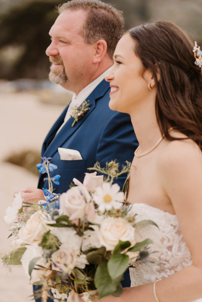 bride walking down the aisle with her father