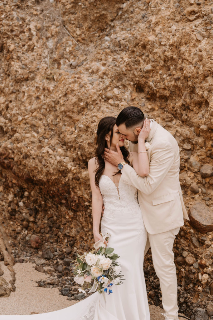 bride and groom posing on the beach at Romantic Beach Wedding in Carmel, CA