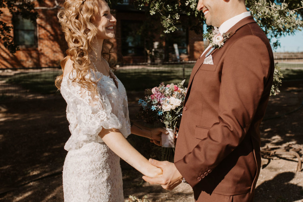 Bride and groom holding hands in Woodland California