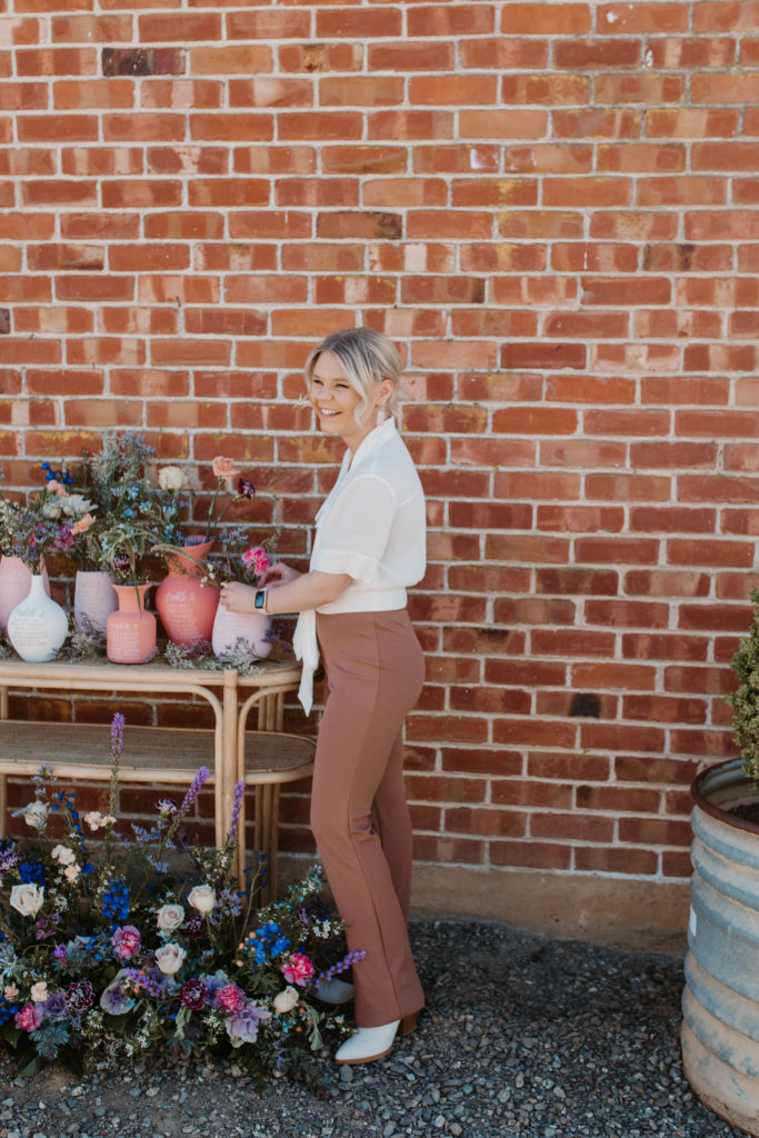 Wedding florist setting up wedding flowers