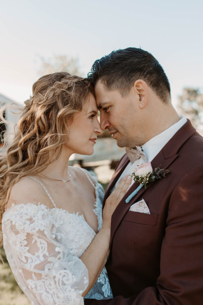 Bride and groom portraits after pastel spring wedding 