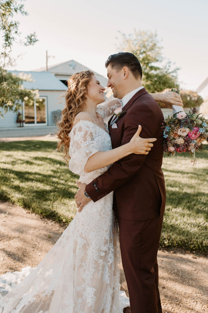 Bride and groom portraits after pastel spring wedding 