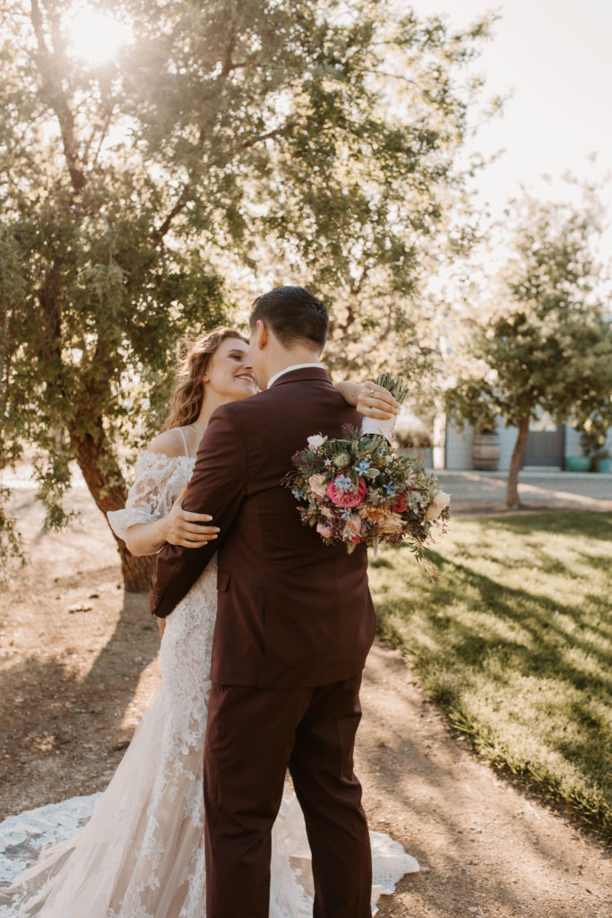 Bride and groom portraits after pastel spring wedding 