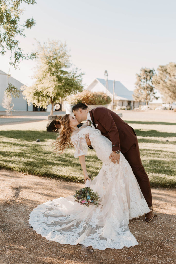 Bride and groom portraits after pastel spring wedding 