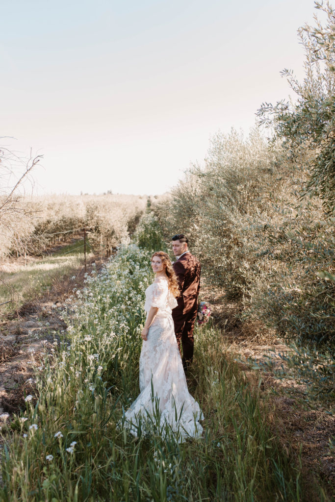 Bride and groom portraits after pastel spring wedding 