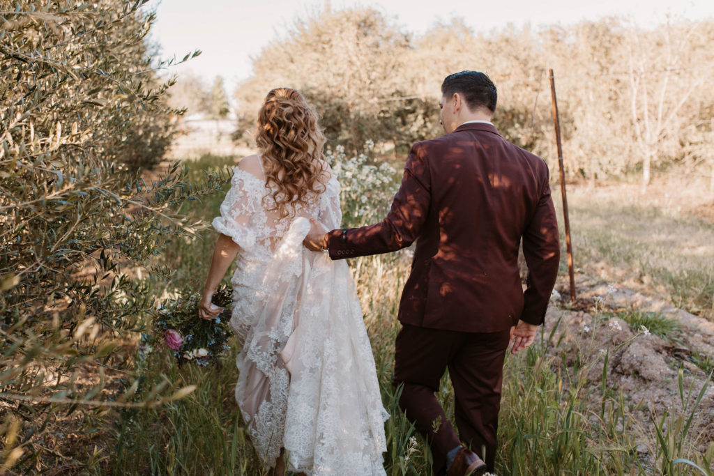 Bride and groom portraits after pastel spring wedding 