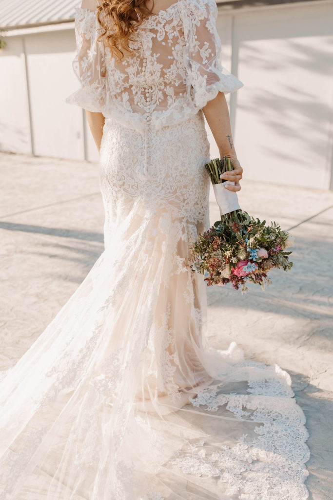 Bride holding spring wedding bouquet