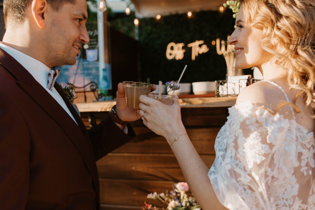 bride and groom drinking