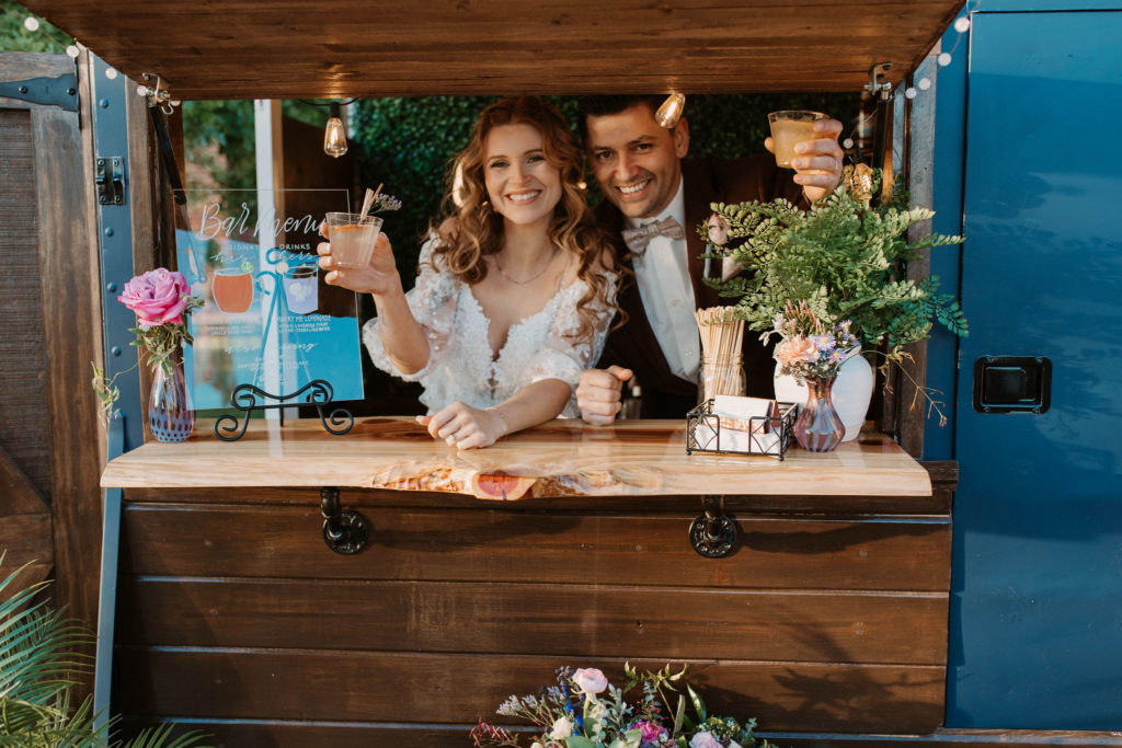 Bride and groom having drinks at the mobile wedding bar in Woodland California