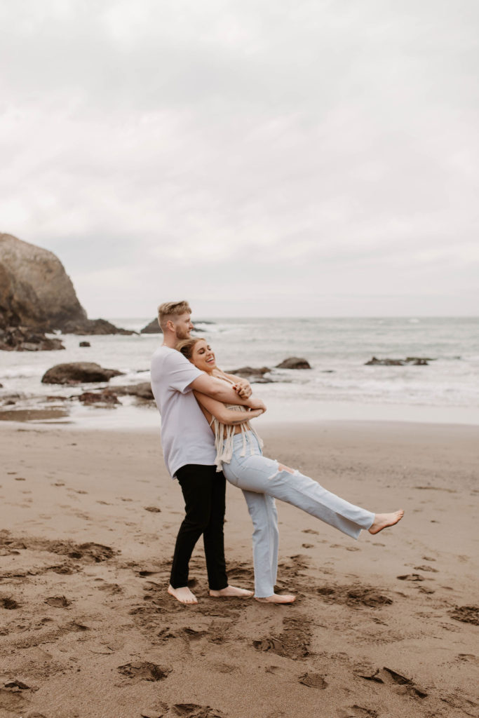 Couple posing for photo shoot couple ideas and prompts on beach in San Francisco California