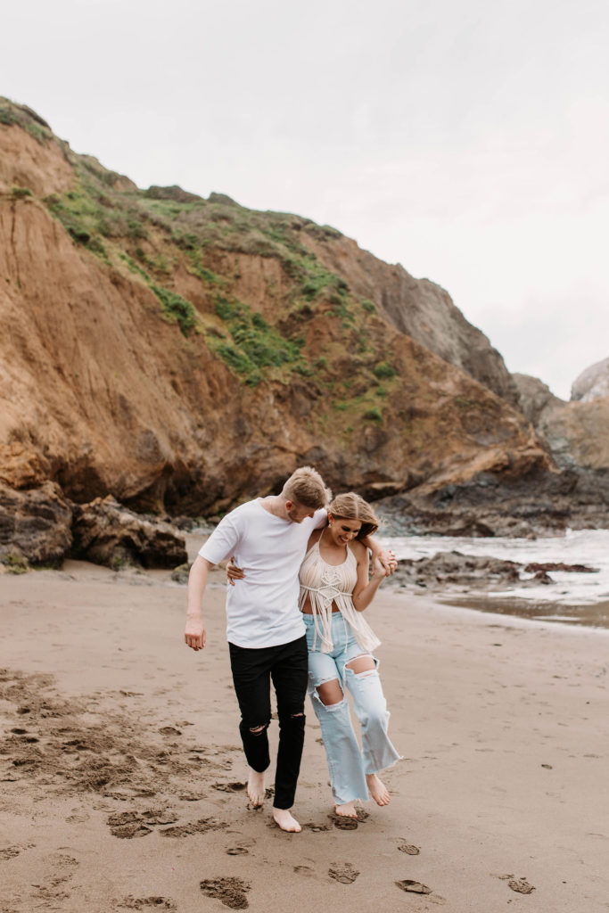 Couple posing for photo shoot couple ideas and prompts on beach in San Francisco California