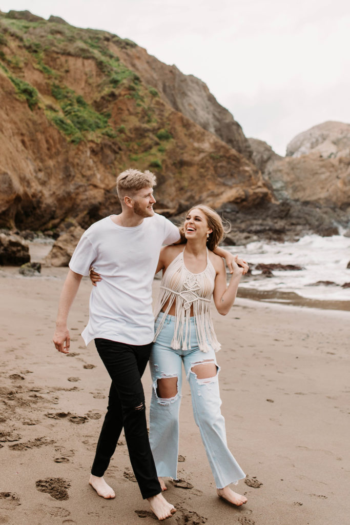 Couple posing for photo shoot couple ideas and prompts on beach in San Francisco California