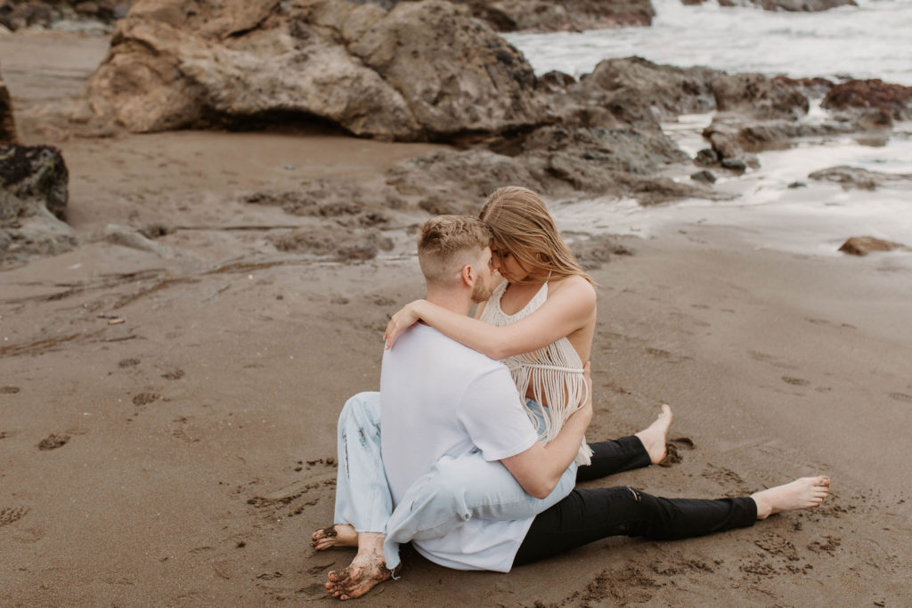 Couple posing for fun photoshoot couple ideas on the beach