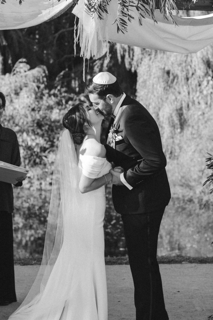 Bride and groom kissing