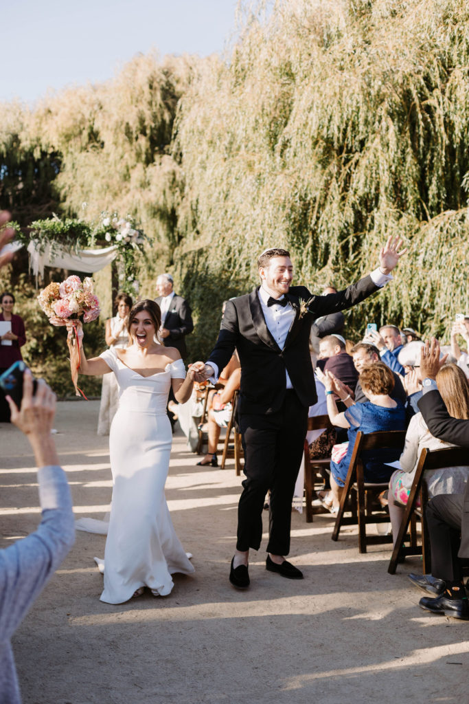 Bride and groom walking down the aisle