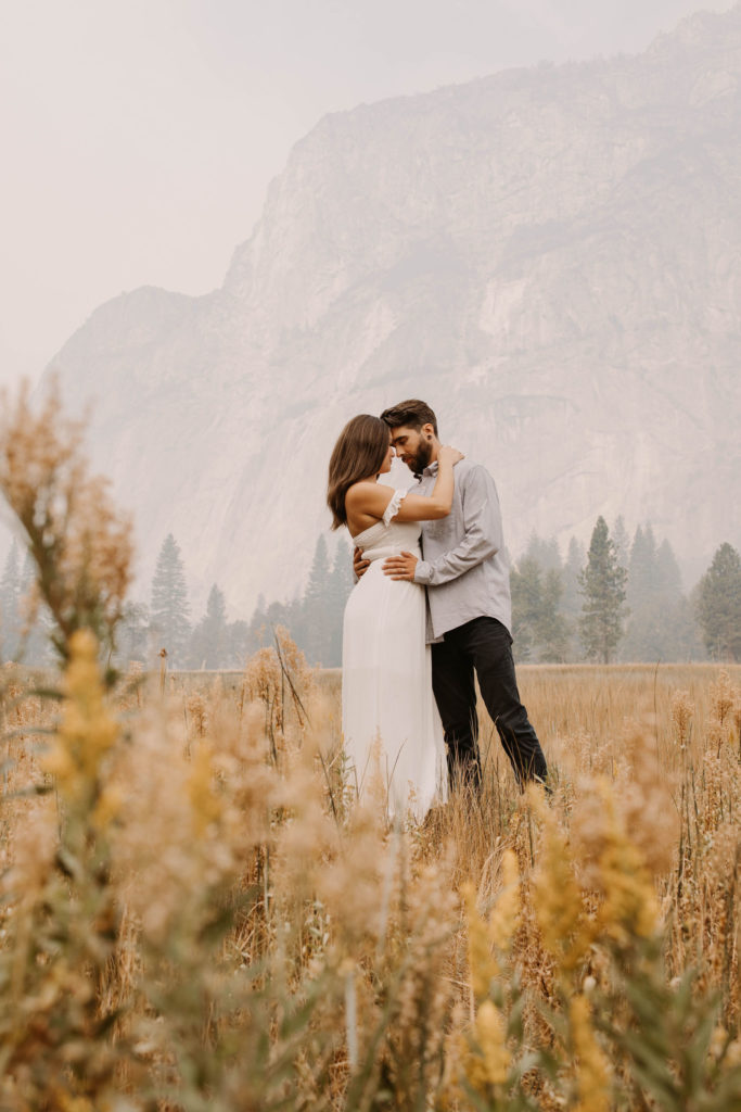 Couple posing for anniversary photos in a national park