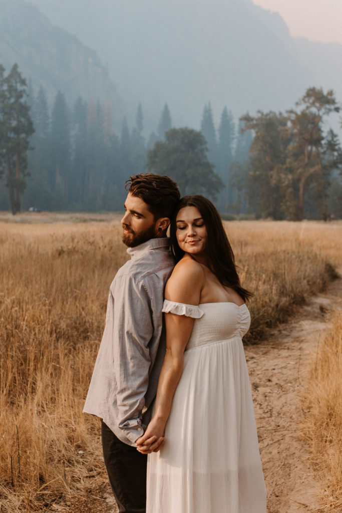 Couple posing for anniversary photos in a national park