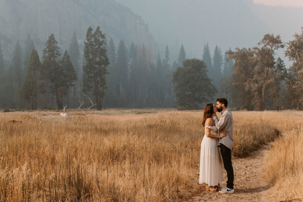 A couple posing for their September Yosemite anniversary photos