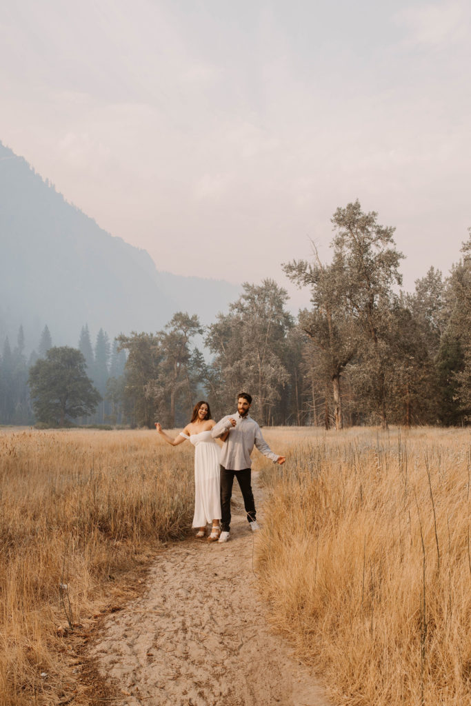 A couple posing for their September Yosemite anniversary photos