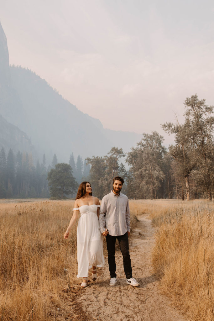 A couple posing for their September Yosemite anniversary photos