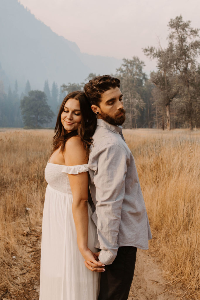 A couple posing for their September Yosemite anniversary photos