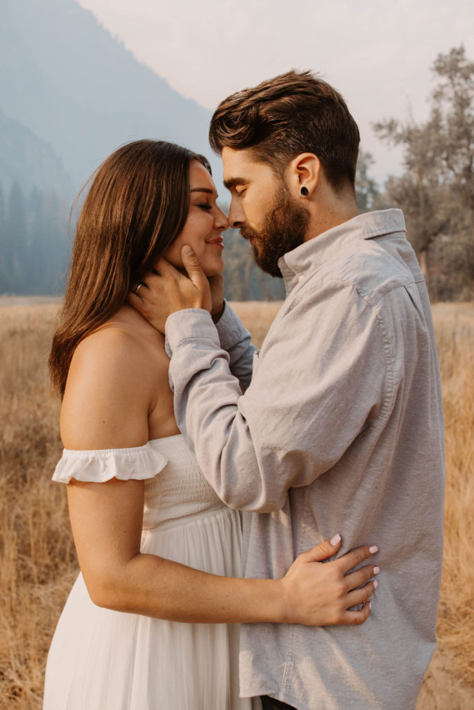 A couple posing for their September Yosemite anniversary photos