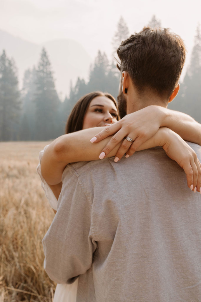 A couple posing for their September Yosemite anniversary photos