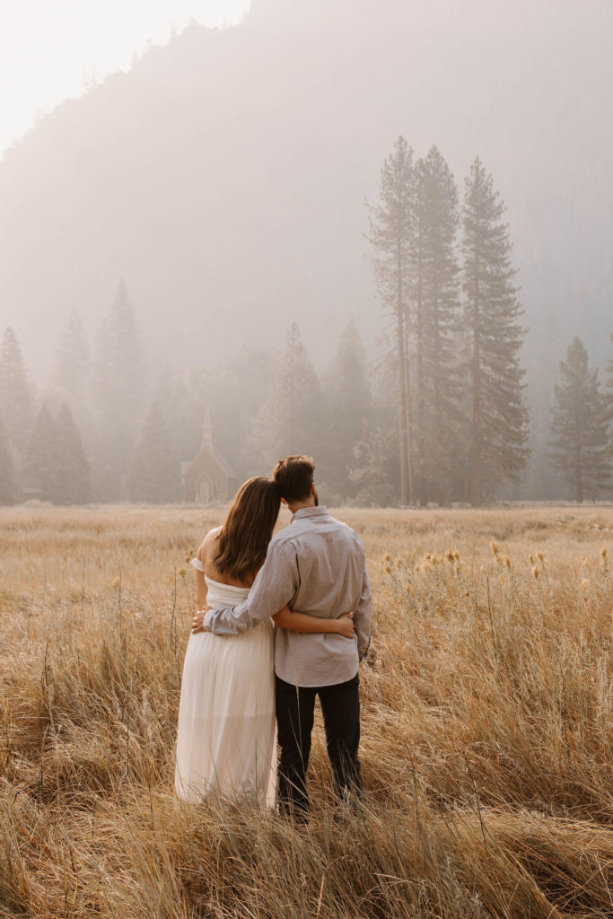 A couple posing for their September Yosemite anniversary photos