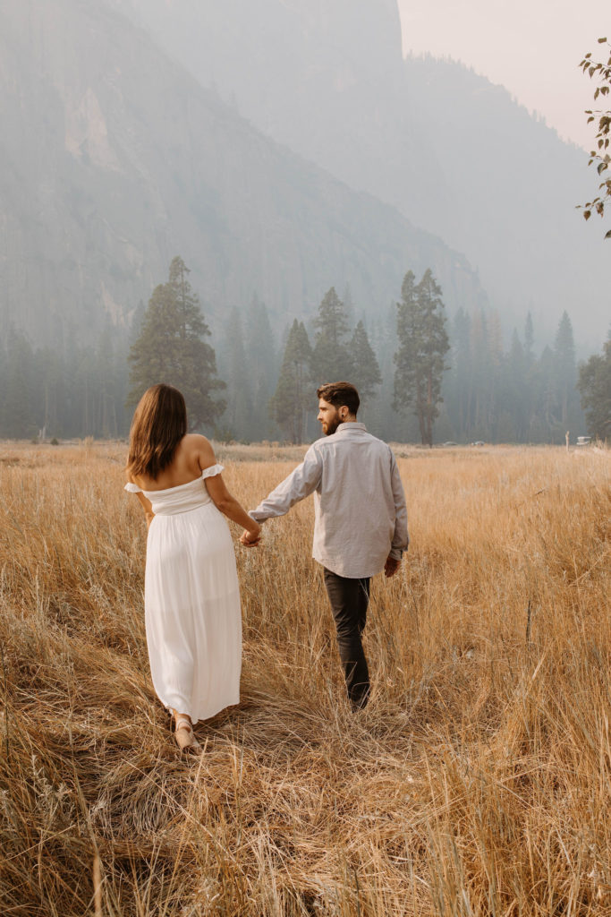 A couple posing for their September Yosemite anniversary photos