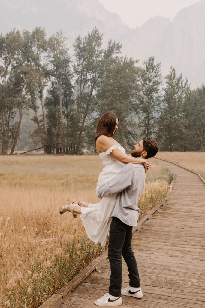 A couple posing for their September Yosemite anniversary photos