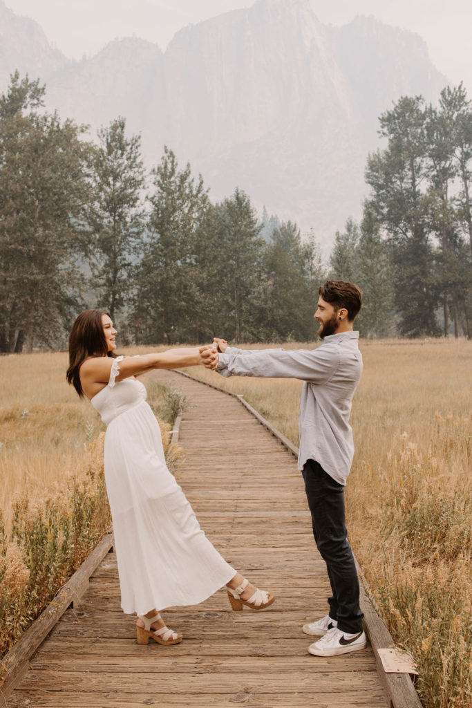 A couple posing for their September Yosemite anniversary photos