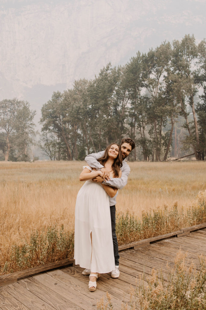 A couple posing for their September Yosemite anniversary photos