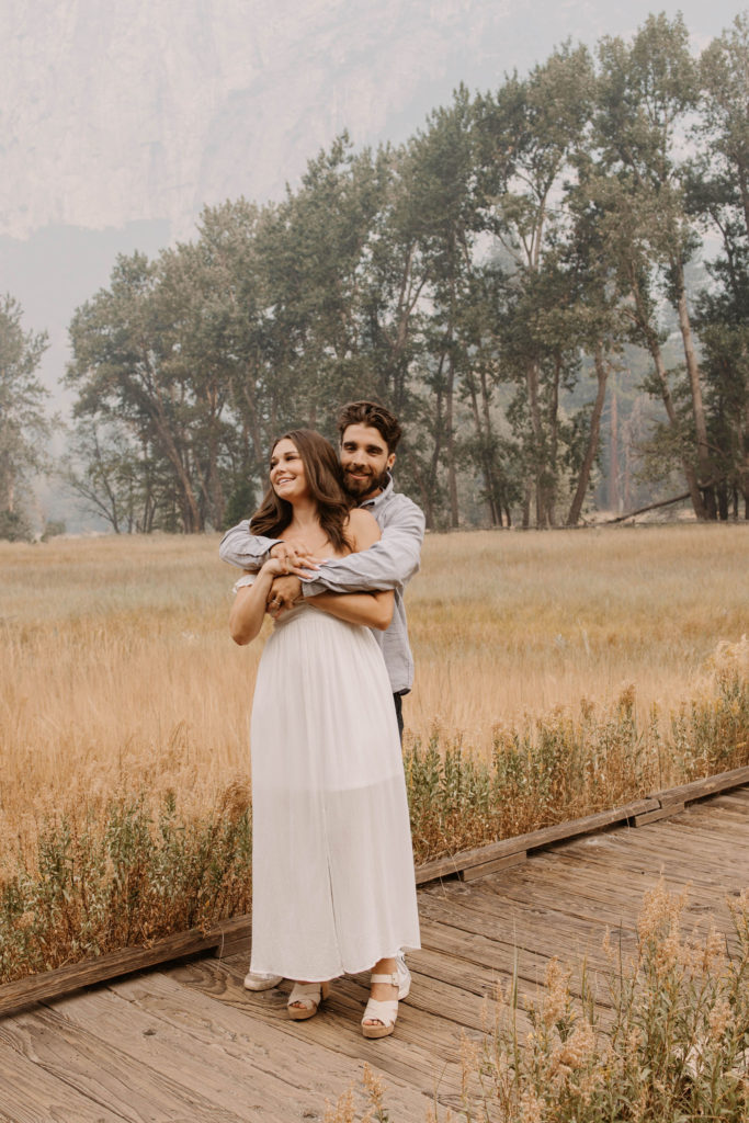 A couple posing for their September Yosemite anniversary photos