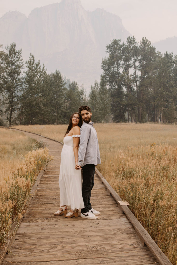 A couple posing for their September Yosemite anniversary photos