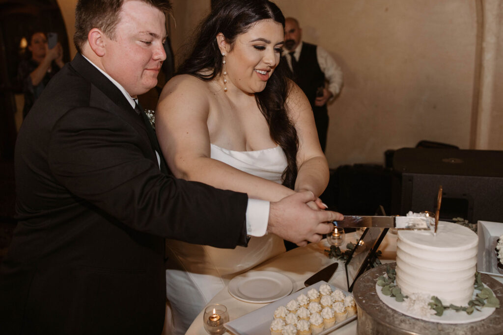 Bride and groom during cake cutting