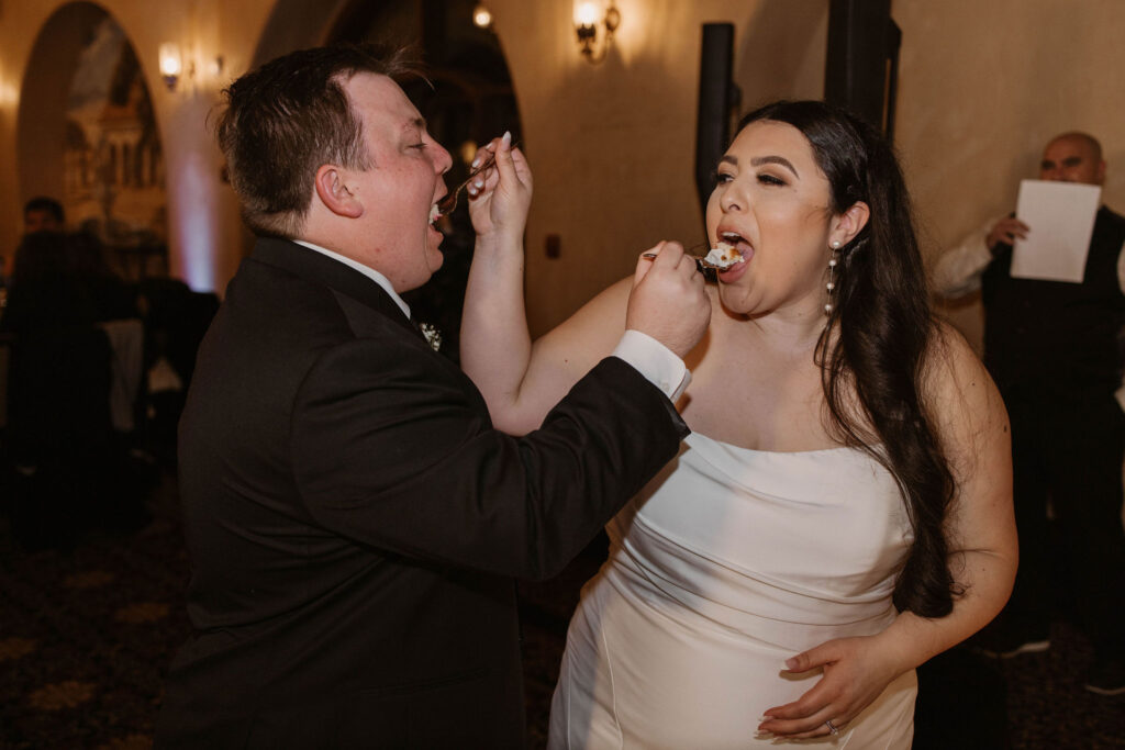 Bride and groom during cake cutting