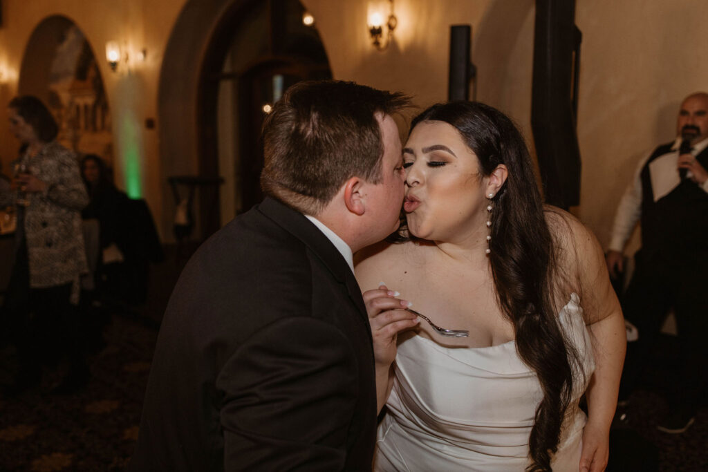 Bride and groom during cake cutting