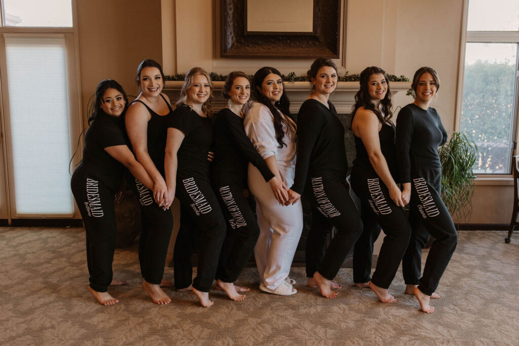 Bride and bridesmaids in sweat suits before ceremony