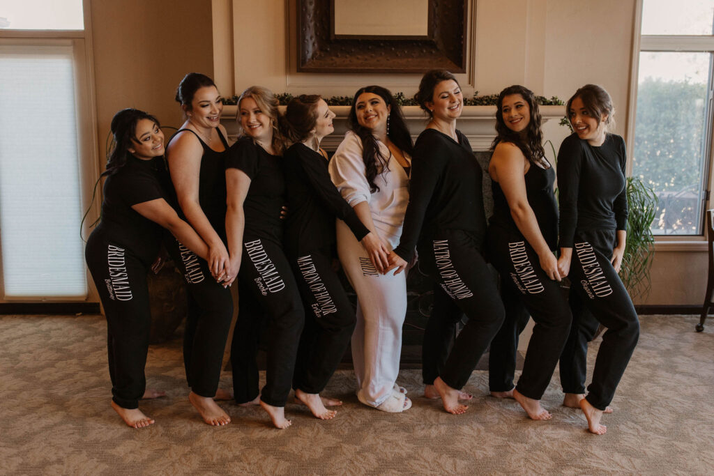 Bride and bridesmaids in sweat suits before ceremony