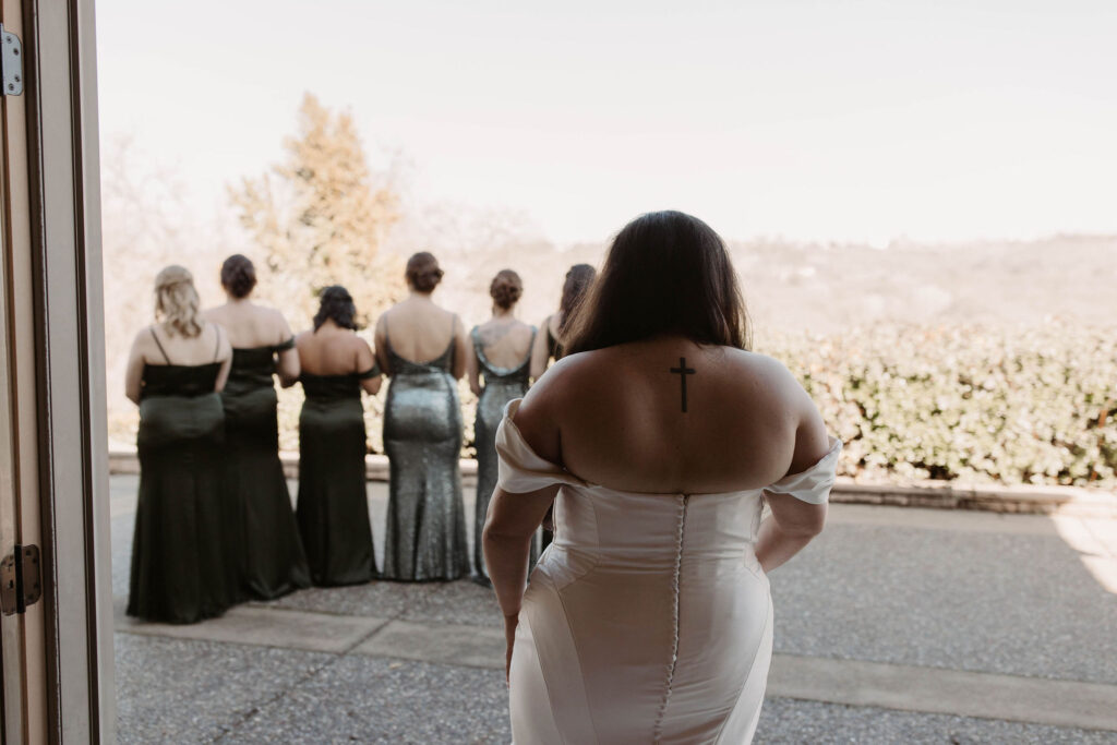 Brides first look with bridesmaids