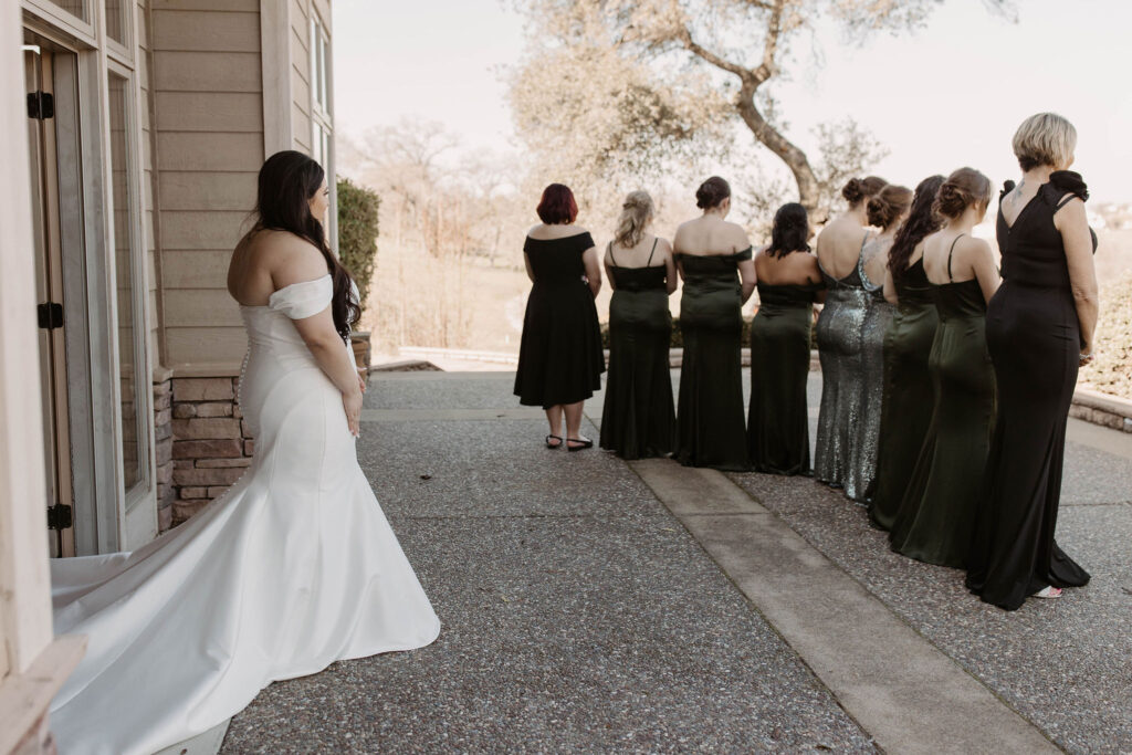 Brides first look with bridesmaids