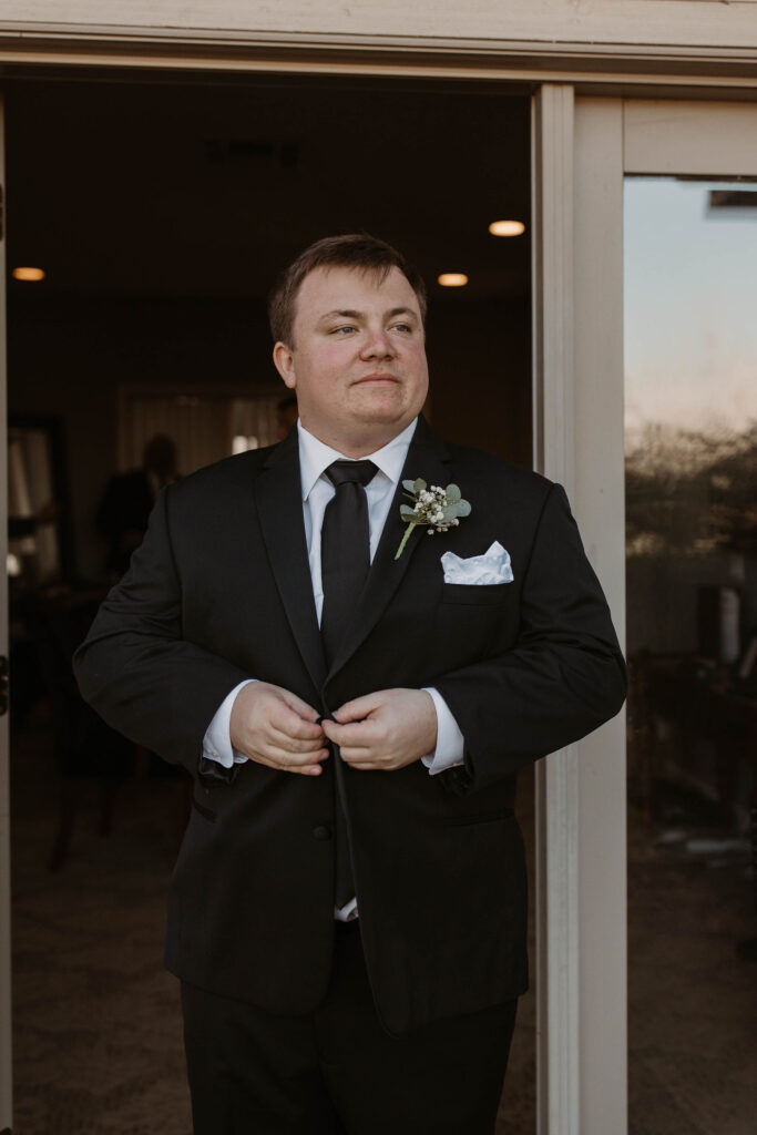 Groom getting ready for wedding in CA