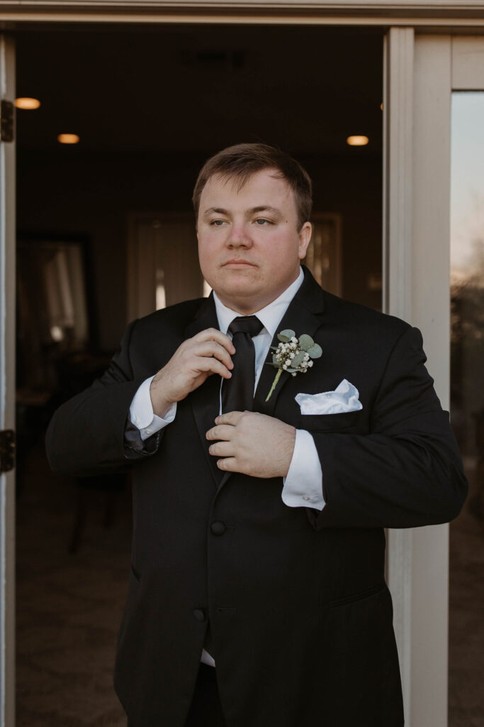 Groom getting ready for wedding in CA