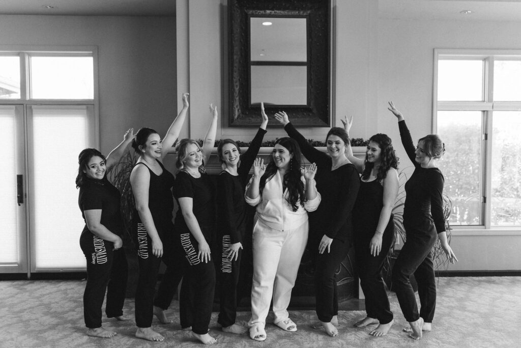 Bride and bridesmaids in sweat suits before ceremony