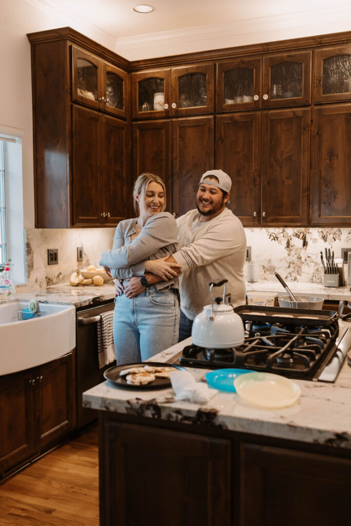 Couple making pancakes during in home couples session - Fun Couples Photoshoot Ideas