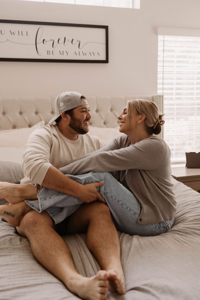 Couple sitting on bed during in home session