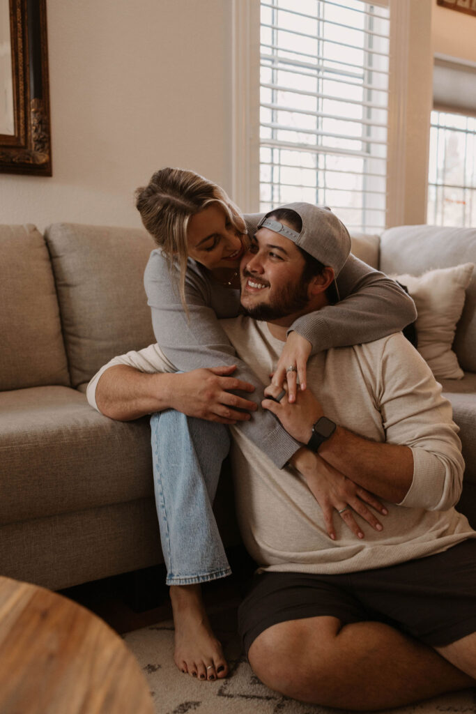 Couple sitting on their couch during photoshoot