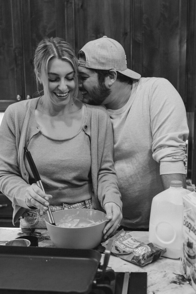 Couple making pancakes during in home couples session - Fun Couples Photoshoot Ideas