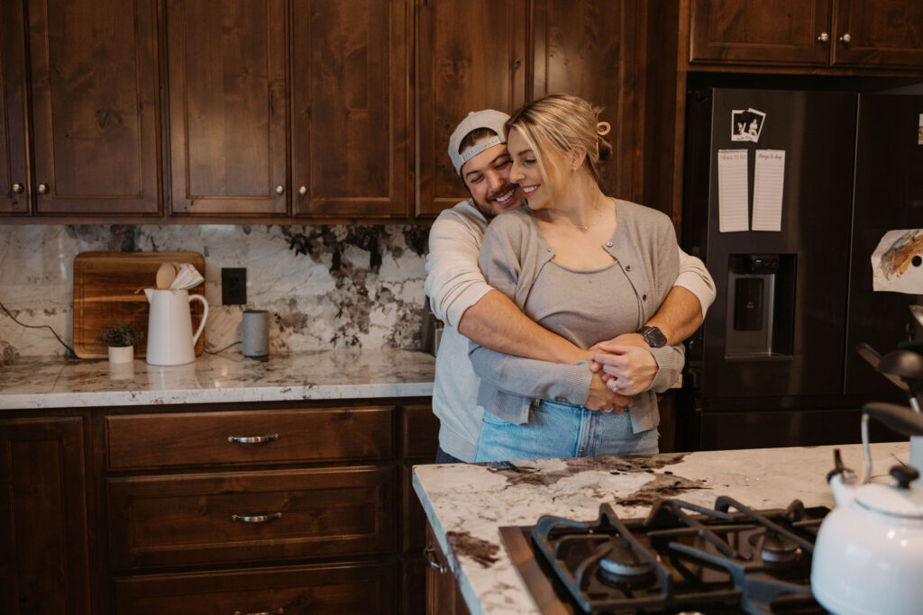 Couple in their kitchen during photoshoot