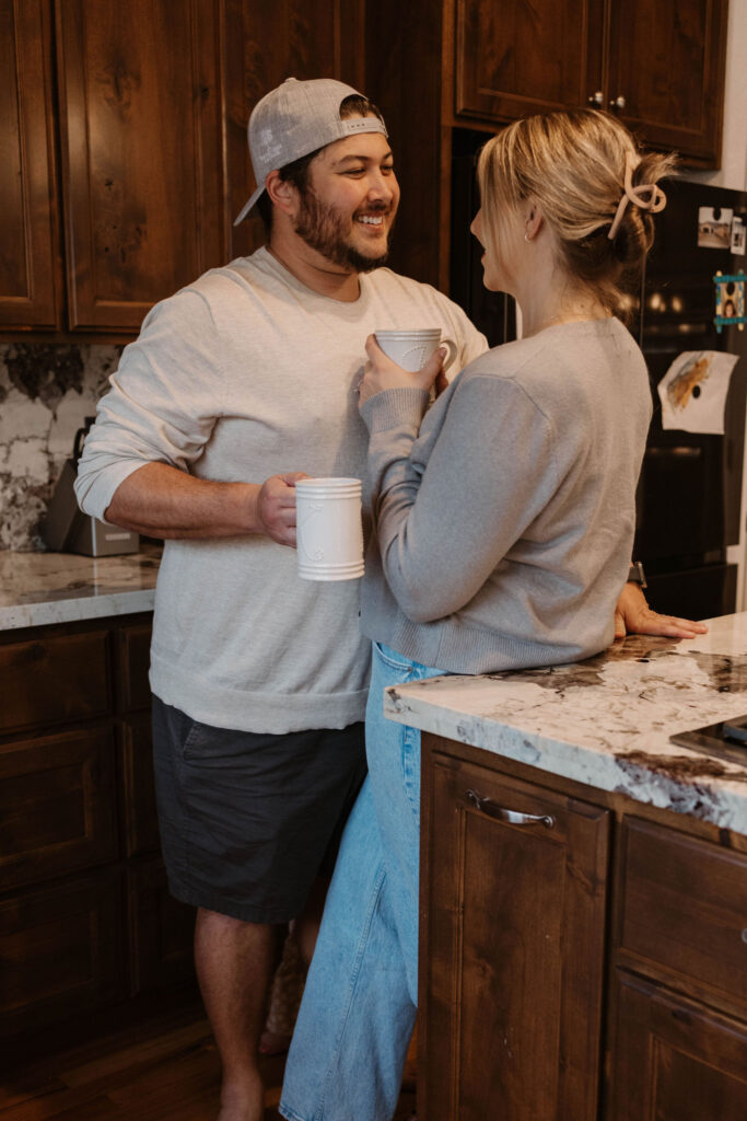 Couple drinking coffee during in home couples session - Fun Couples Photoshoot Ideas